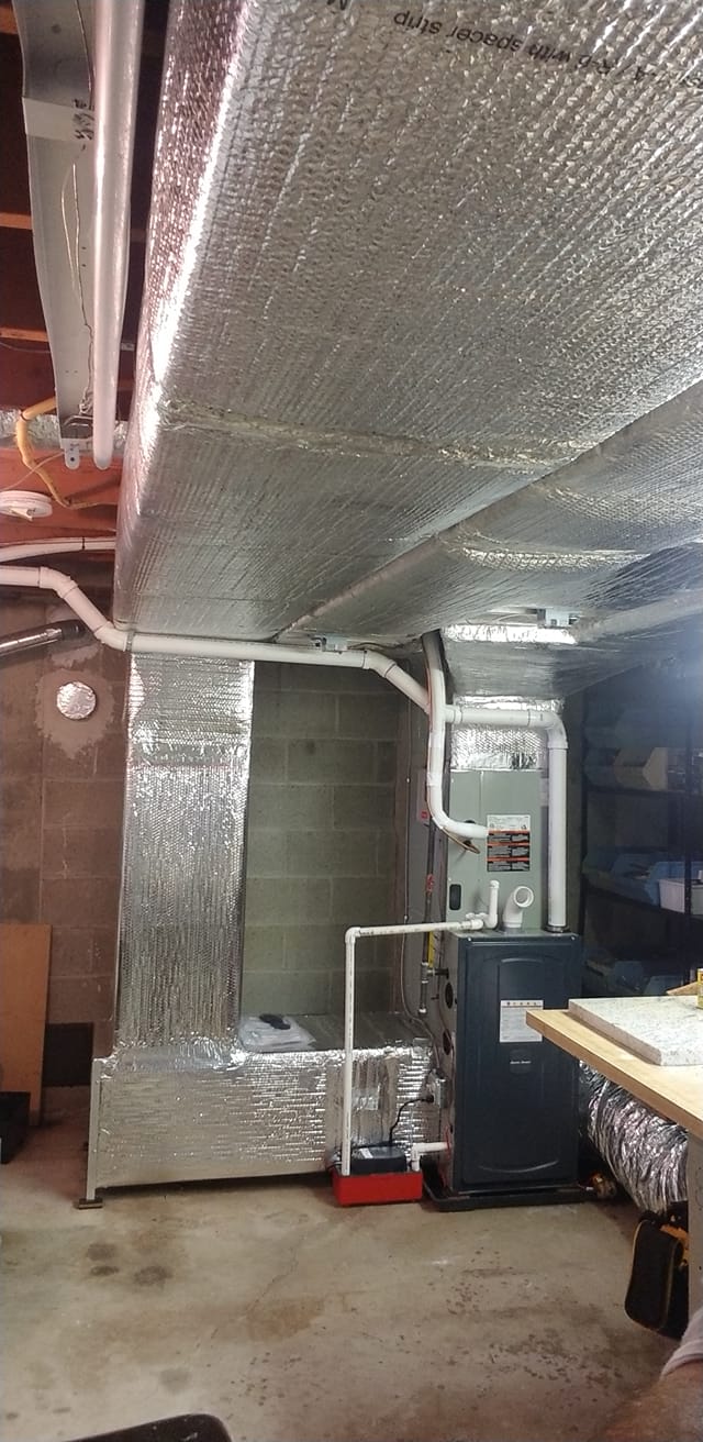 Basement furnace with insulated ductwork